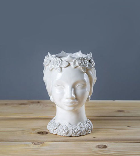 White ceramic head vase adorned with a hand-applied flower wreath, showcasing intricate craftsmanship and detail.